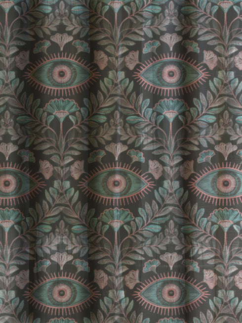 Sheer curtain panel featuring repeating sage green and blush pink evil eye motif surrounded by botanical elements on dark gray background. Linen-textured polyester fabric allows filtered light while providing elegant window covering with protective symbolism for Victorian or gothic interiors.